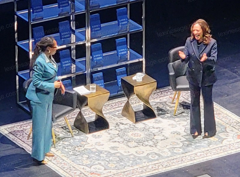 MVP Kamala Harris arrives on stage, joined with Oakland Congressman Lateefah Simon